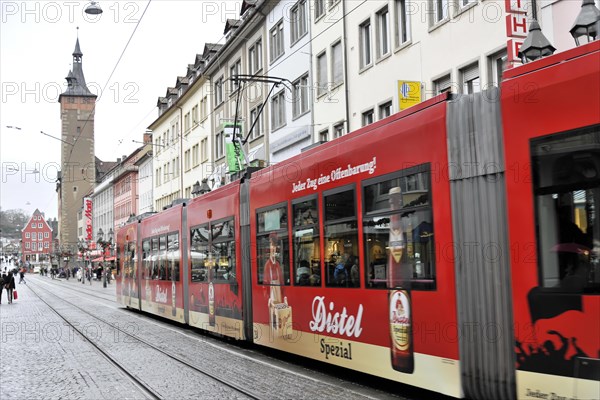 Wuerzburg, tram with advertisement drives through a busy shopping street in Wuerzburg, Wuerzburg, Lower Franconia, Bavaria, Germany, Europe