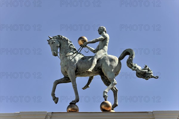 Granada, Statue of a horseman on horseback in front of a clear blue sky on the roof of a building, Granada, Andalusia, Spain, Europe