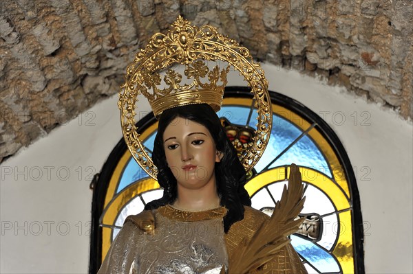 Castillo de Santa Catalina in Jaen, A statue of a crowned saint with a palm branch in a church, Granada, Andalusia, Spain, Europe