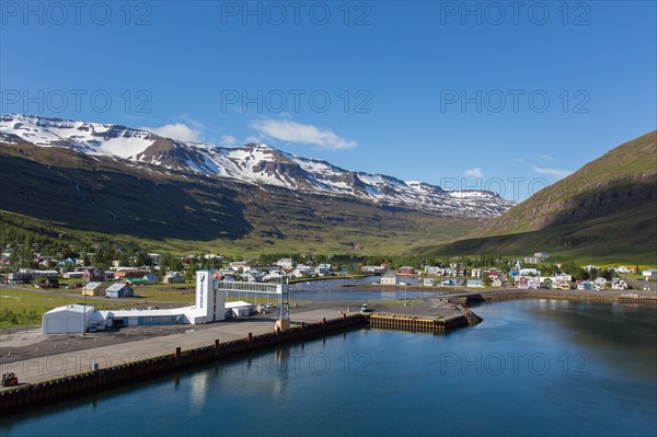 View over harbour and town Seyoisfjoerour along the fjord Seydisfjoerdur in summer, Eastern Region, Austurland, Iceland, Europe