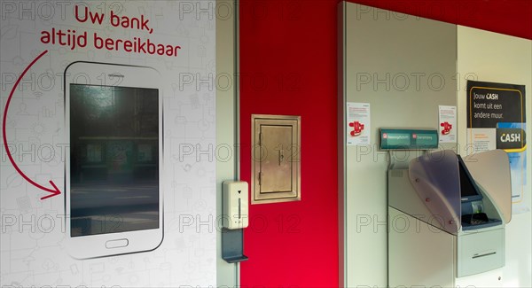 Indoor ATM cash dispenser, cashpoint of Belfius bank office in village, East Flanders, Belgium, Europe