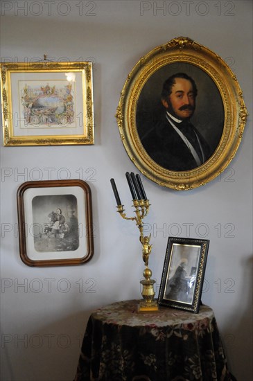 Langenburg Castle, wall with paintings, photos and candlesticks in historical style, Langenburg Castle, Langenburg, Baden-Wuerttemberg, Germany, Europe