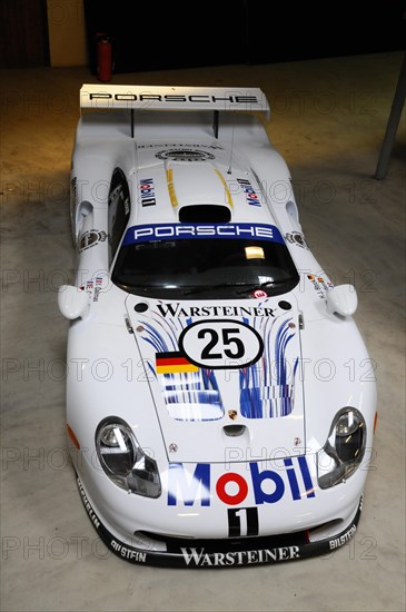 Deutsches Automuseum Langenburg, White Porsche 911 racing car with Mobil1 and Warsteiner advertising in the museum, Deutsches Automuseum Langenburg, Langenburg, Baden-Wuerttemberg, Germany, Europe