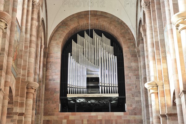 Speyer Cathedral, large church organ behind a grille, flanked by stone pillars, Speyer Cathedral, Unesco World Heritage Site, foundation stone laid around 1030, Speyer, Rhineland-Palatinate, Germany, Europe
