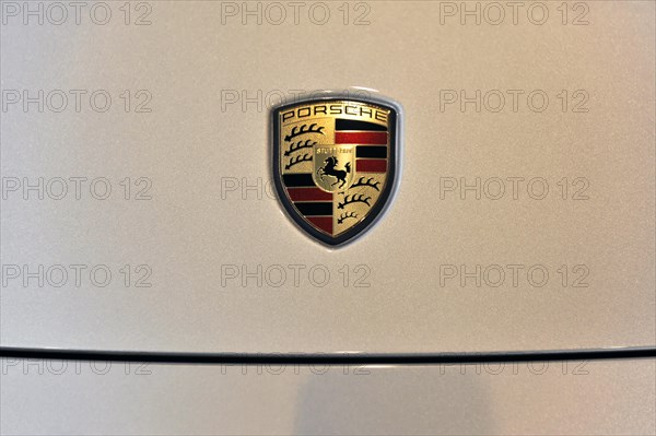Close-up of the metallic Porsche emblem on a car, Schwaebisch Gmuend, Baden-Wuerttemberg, Germany, Europe