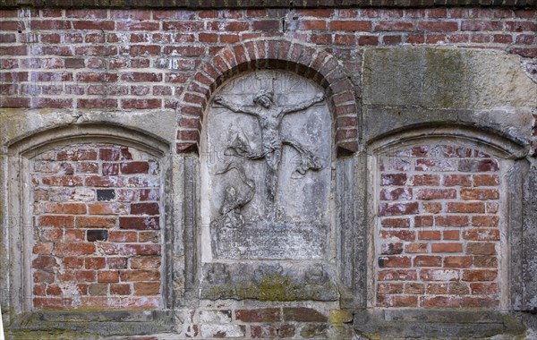 Stone relief of the crucified Christ at St Mary's Cathedral, Havelberg, Saxony-Anhalt, Germany, Europe