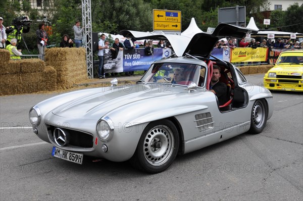 A silver Mercedes classic car with gullwing doors and starting number 417 at a festival, SOLITUDE REVIVAL 2011, Stuttgart, Baden-Wuerttemberg, Germany, Europe