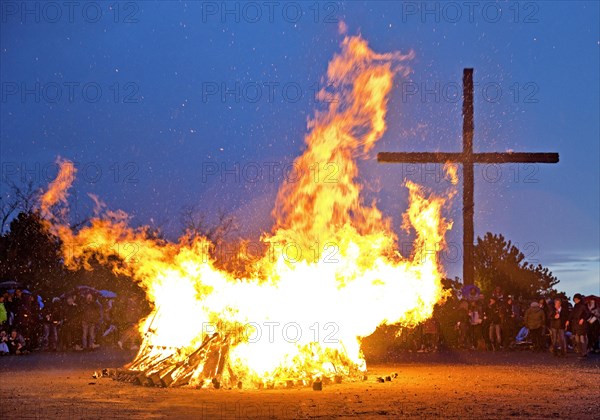 Easter bonfire on the Haniel spoil tip in front of the summit cross, Bottrop, Ruhr area, North Rhine-Westphalia, Germany, Europe