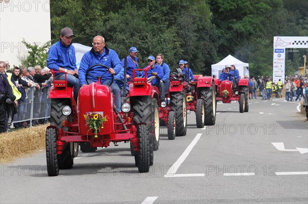 Porsche Diesel Tractors, A row of tractors and their drivers at a parade, surrounded by spectators, SOLITUDE REVIVAL 2011, Stuttgart, Baden-Wuerttemberg, Germany, Europe