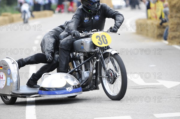 A motorcyclist on a classic racing motorbike in front of an eager audience, SOLITUDE REVIVAL 2011, Stuttgart, Baden-Wuerttemberg, Germany, Europe