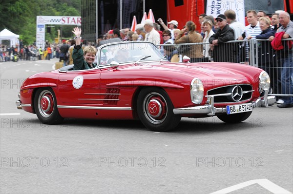 Driver of a red Mercedes convertible waving during a racing event, SOLITUDE REVIVAL 2011, Stuttgart, Baden-Wuerttemberg, Germany, Europe