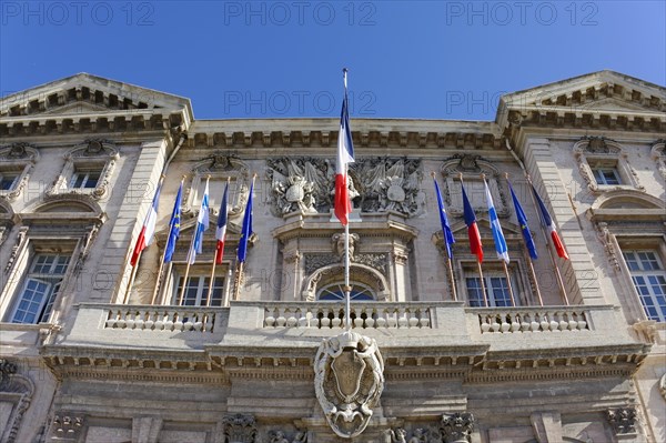 Old Town Hall, Hotel de Ville, at the Old Harbour, Classical architecture of a building with French flags and ornaments, Marseille, Departement Bouches-du-Rhone, Region Provence-Alpes-Cote d'Azur, France, Europe