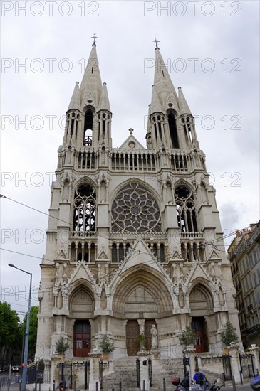 Church of Saint-Vincent-de-Paul, A Gothic church with twin towers rises in an urban setting, Marseille, Departement Bouches-du-Rhone, Provence-Alpes-Cote d'Azur region, France, Europe