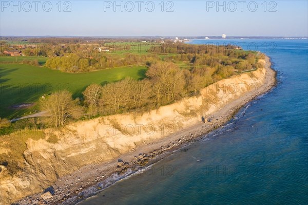 Aerial view over beach and Brodtener Ufer, Brodten Steilufer, cliff in the Bay of Luebeck along the Baltic Sea at sunrise, Schleswig-Holstein, Germany, Europe