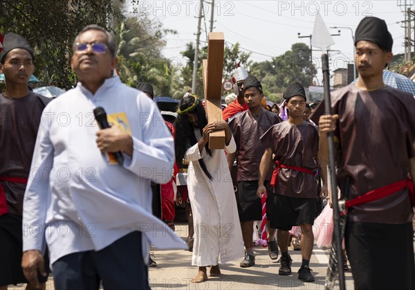 Christian devotees takes part in a perform to re-enactment of the crucifixion of Jesus Christ during a procession on Good Friday, on March 29, 2024 in Guwahati, Assam, India. Good Friday is a Christian holiday commemorating the crucifixion of Jesus Christ and his death at Calvary