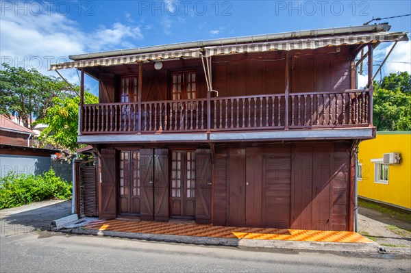 Deshaies, historic Caribbean wooden building of a street in Guadeloupe, Caribbean, French Antilles