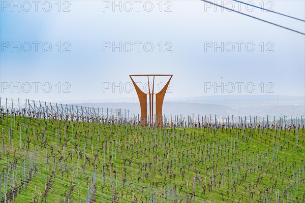 Expansive vineyard landscape with a striking art installation under a cloudy sky, Jesus Grace Chruch, Weitblickweg, Easter hike, Hohenhaslach, Germany, Europe
