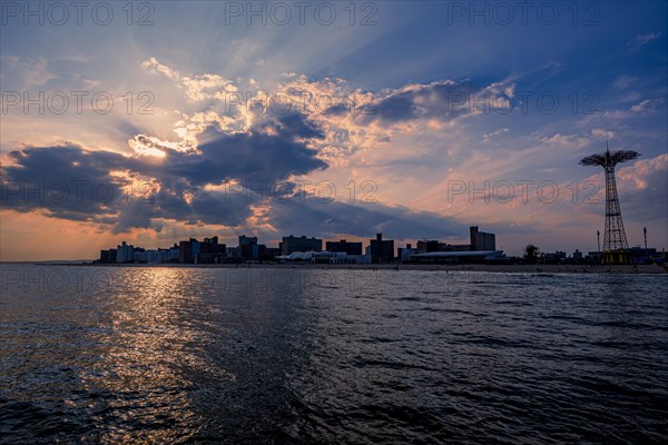 Sun sets on a warm summer day in Coney Island, Brooklyn, NY, USA, USA, North America