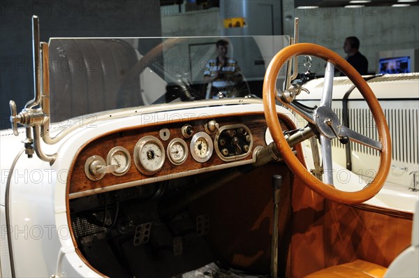 Museum, Mercedes-Benz Museum, Stuttgart, Interior view of a classic car with wooden dashboard and steering wheel, Mercedes-Benz Museum, Stuttgart, Baden-Wuerttemberg, Germany, Europe