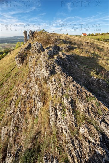 Evening on the Ehrenbuerg witness mountain, also known as Walberla, with Walburgis Chapel and Wiesenthauer Nadel rock formation, Veldensteiner Forst nature park Park, Forchheim, Upper Franconia, Franconian Switzerland, Bavaria, Germany, Europe