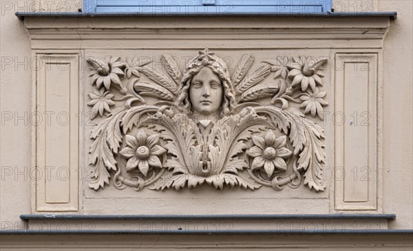 Relief with a woman's face on a house wall, Havelberg, Saxony-Anhalt, Germany, Europe