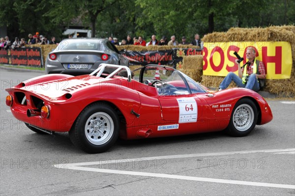 Rear view of a red Fiat Abarth racing car on a race track with straw bales, SOLITUDE REVIVAL 2011, Stuttgart, Baden-Wuerttemberg, Germany, Europe