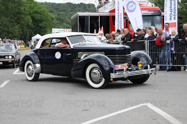 An elegant black vintage convertible drives past spectators, SOLITUDE REVIVAL 2011, Stuttgart, Baden-Wuerttemberg, Germany, Europe