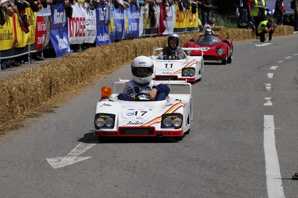 Two people in white racing suits steer their soapboxes during a race, SOLITUDE REVIVAL 2011, Stuttgart, Baden-Wuerttemberg, Germany, Europe