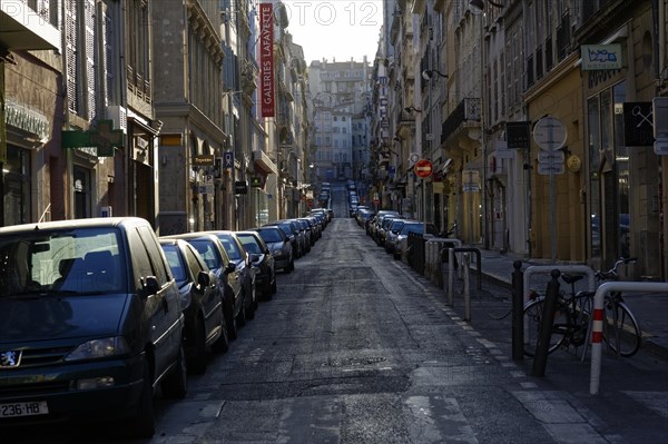 Marseille in the morning, An empty city street at dawn with parked cars and a bicycle, Marseille, Departement Bouches-du-Rhone, Region Provence-Alpes-Cote d'Azur, France, Europe