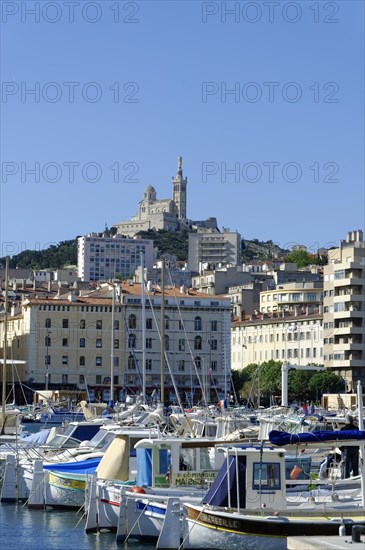 The old harbour, Vieux Port, behind the basilica Notre-Dame de la Garde, Marseille, A view of the old harbour of Marseille with the church in the background, Marseille, Departement Bouches du Rhone, Region Provence Alpes Cote d'Azur, France, Europe