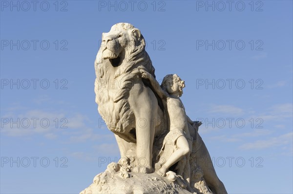 Marseille, White marble sculpture of a lion and a woman in front of a blue sky, Marseille, Departement Bouches-du-Rhone, Provence-Alpes-Cote d'Azur region, France, Europe