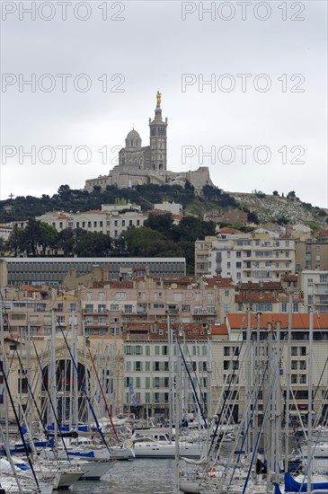 Marseille, View of Marseille with church on the hill and harbour in the foreground, Marseille, Departement Bouches-du-Rhone, Region Provence-Alpes-Cote d'Azur, France, Europe