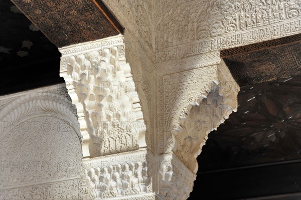 Artistic stone carvings, Alhambra, Granada, Detail of a richly decorated ceiling and columns with stucco in Moorish style, Granada, Andalusia, Spain, Europe