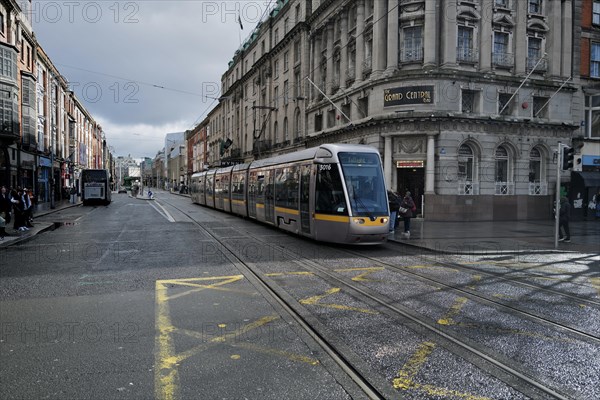 A Luas tram stops for passengers on a day of mixed weather. Dublin, Ireland, Europe