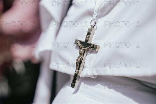 A nun wears a Cross as she recite prayers during a re-enactment of the crucifixion of Jesus Christ to mark the Good Friday, on March 29, 2024 in Guwahati, Assam, India. Good Friday is a Christian holiday commemorating the crucifixion of Jesus Christ and his death at Calvary