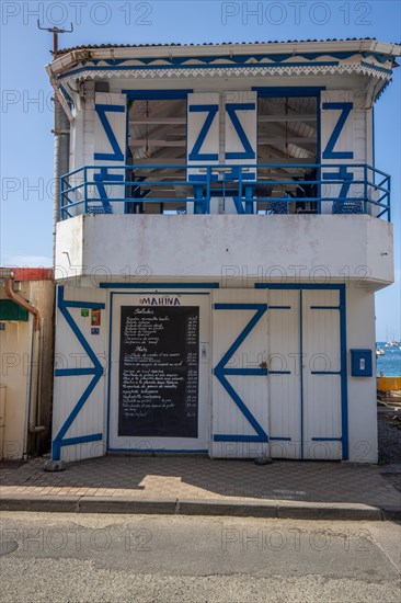 Deshaies, historic Caribbean wooden building of a street in Guadeloupe, Caribbean, French Antilles