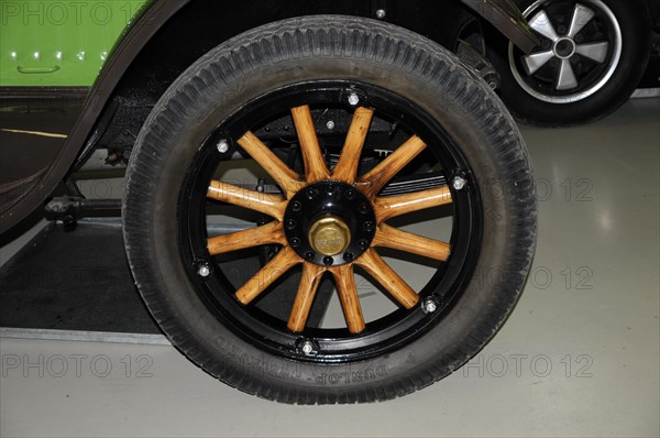 Deutsches Automuseum Langenburg, Close-up of a classic black car tyre with wooden spokes, Deutsches Automuseum Langenburg, Langenburg, Baden-Wuerttemberg, Germany, Europe