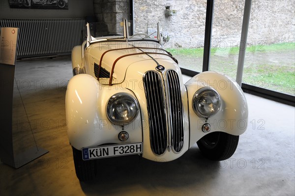 BMW 328 built in 1931, Deutsches Automuseum Langenburg, A white BMW classic car in convertible design displayed next to a window, Deutsches Automuseum Langenburg, Langenburg, Baden-Wuerttemberg, Germany, Europe