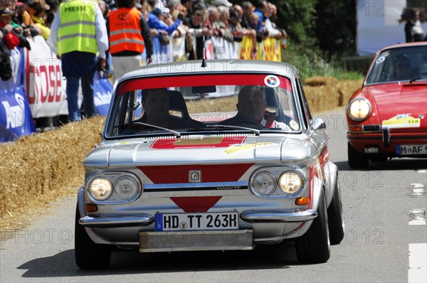 A red vintage car races in front of spectators, SOLITUDE REVIVAL 2011, Stuttgart, Baden-Wuerttemberg, Germany, Europe