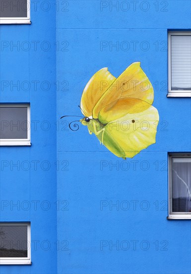 Sunflower house, painted yellow lemon butterfly on a skyscraper, artist Ulrich Allgaier, Wuppertal, North Rhine-Westphalia, Germany, Europe