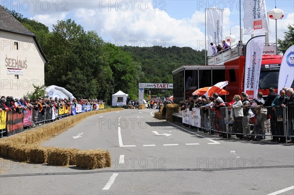 View of a race track with spectators and advertising banners on a cloudy day, SOLITUDE REVIVAL 2011, Stuttgart, Baden-Wuerttemberg, Germany, Europe