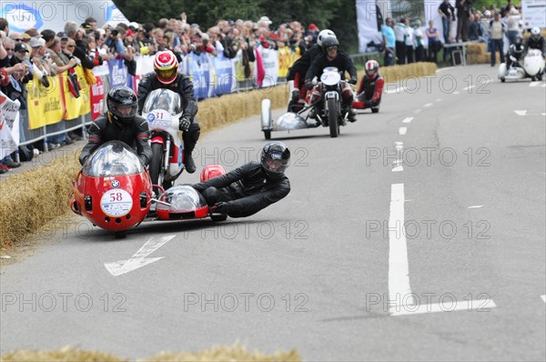 Several motorbikes with sidecars compete in a race in front of an audience, SOLITUDE REVIVAL 2011, Stuttgart, Baden-Wuerttemberg, Germany, Europe