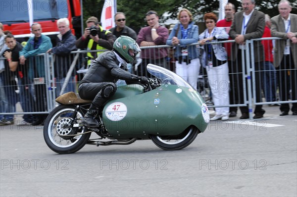 Racer on a sidecar motorbike in action in front of an audience along the race track, SOLITUDE REVIVAL 2011, Stuttgart, Baden-Wuerttemberg, Germany, Europe