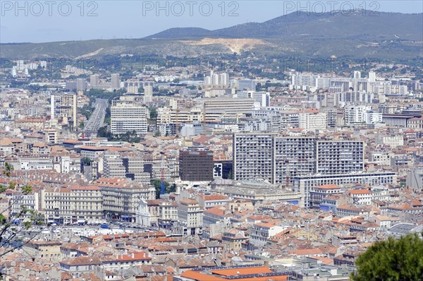 Marseille, Panoramic view of the city of Marseille with buildings and hills in the background, Marseille, Departement Bouches-du-Rhone, Region Provence-Alpes-Cote d'Azur, France, Europe