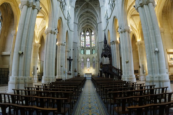 Church of Saint-Vincent-de-Paul, interior view of a church with rows of columns, pews and light falling on the altar, Marseille, Departement Bouches-du-Rhone, Provence-Alpes-Cote d'Azur region, France, Europe