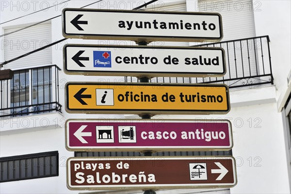 Several signposts with pictograms indicating different tourist destinations, Andalusia, Spain, Europe