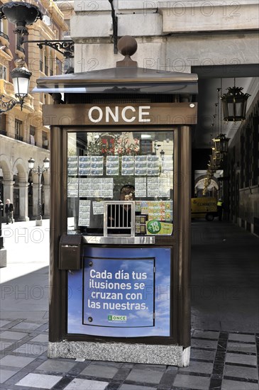 Granada, Lotto kiosk on a corner with posters and billboards on a Spanish street, Granada, Andalusia, Spain, Europe