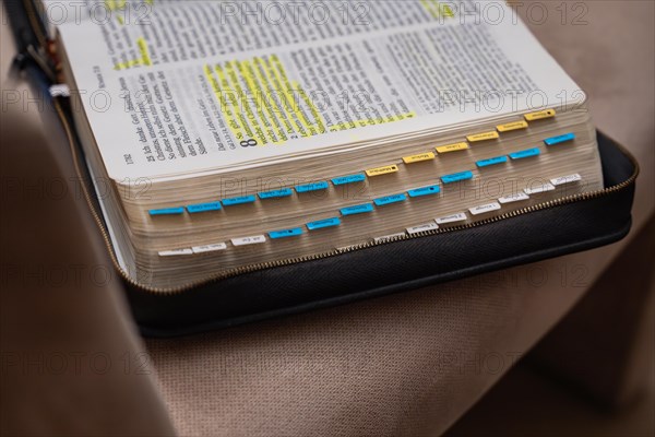 Open Bible with yellow and blue bookmark on a black book cover, Bibelkreis, Jesus Grace Chruch, Ludwigsburg, Germany, Europe