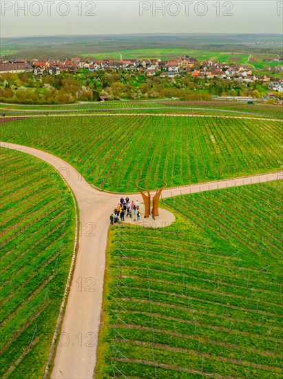 People standing at a fork in a vineyard with a village in the distance, Jesus Grace Chruch, Weitblickweg, Easter hike, Hohenhaslach, Germany, Europe