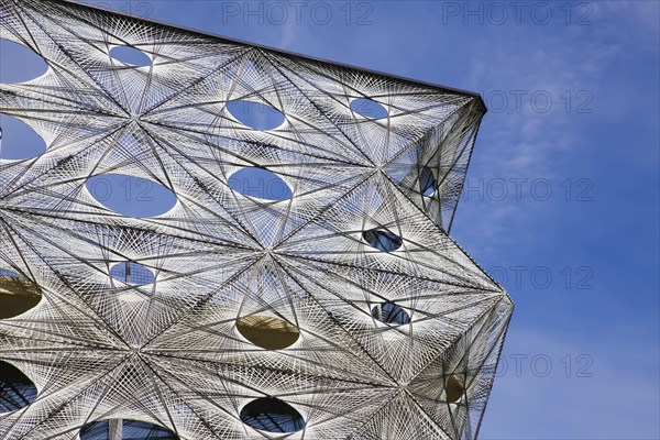 Reutlingen University, Reutlingen University, Texoversum, German University Building Award 2024 for TEXOVERSUM, modern architecture, facade made of carbon and glass fibres, mesh, innovative, identity-creating, unique facade, campus, place of learning, special, extraordinary new building for textile courses, light, airy, airy, holes, detail, architectural eye-catcher, Reutlingen, Baden-Wuerttemberg, Germany, Europe